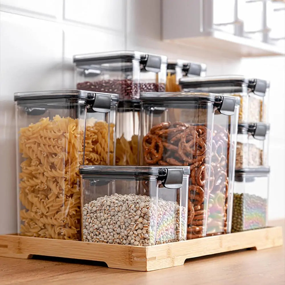 Set of airtight plastic pantry containers with plastic lids, perfect for storing cereals, snacks, and kitchen staples.