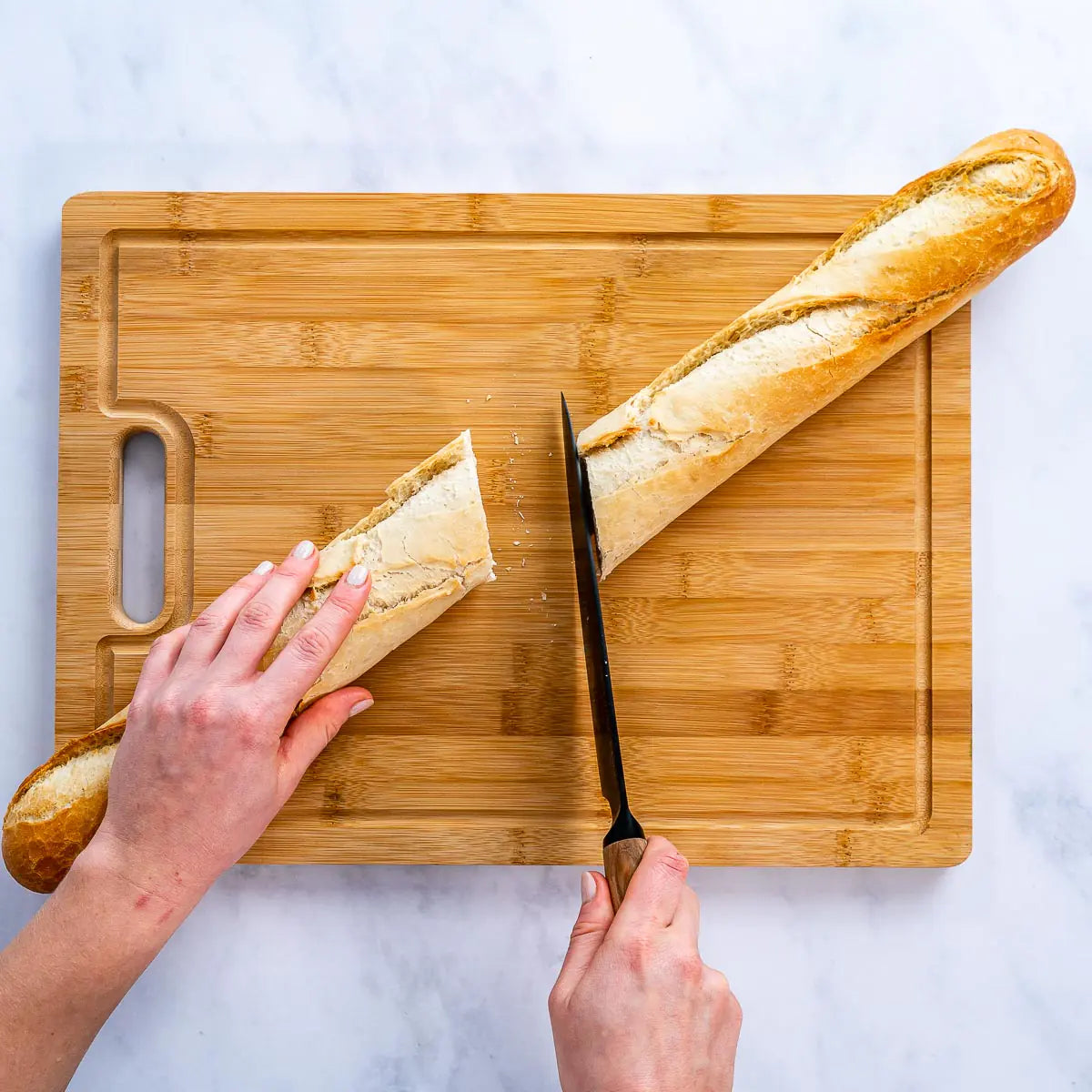 Extra-large bamboo cutting board for kitchen use, knife-friendly, durable, and easy to clean.