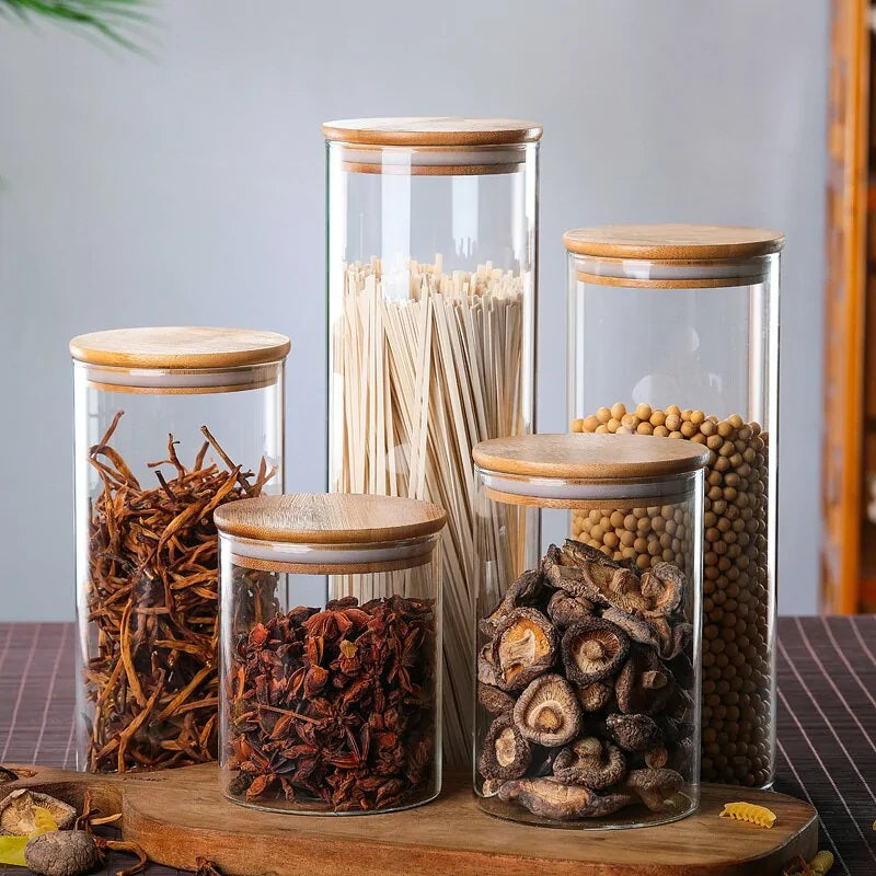 Airtight glass canister with bamboo lid, perfect for storing food, cereals, and dry goods.