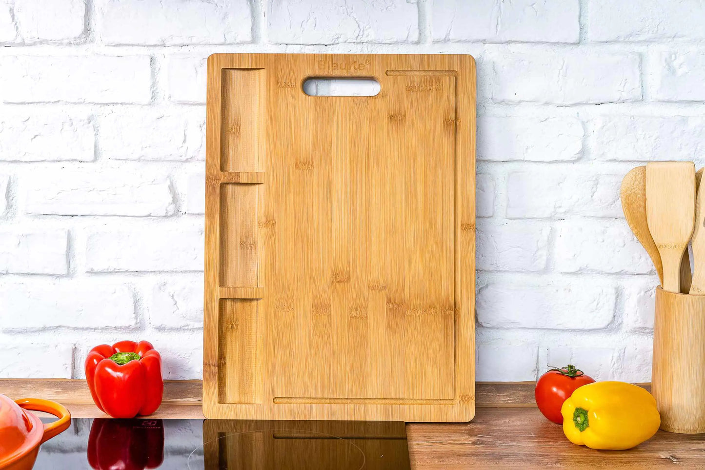 Premium bamboo cutting board, oversized wooden surface with juice groove, perfect for meal preparation.